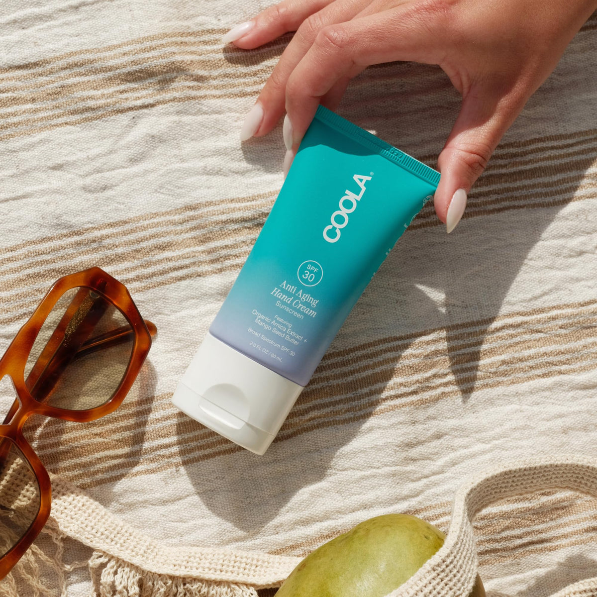 COOLA SPF 30 label close-up emphasizing broad-spectrum protection