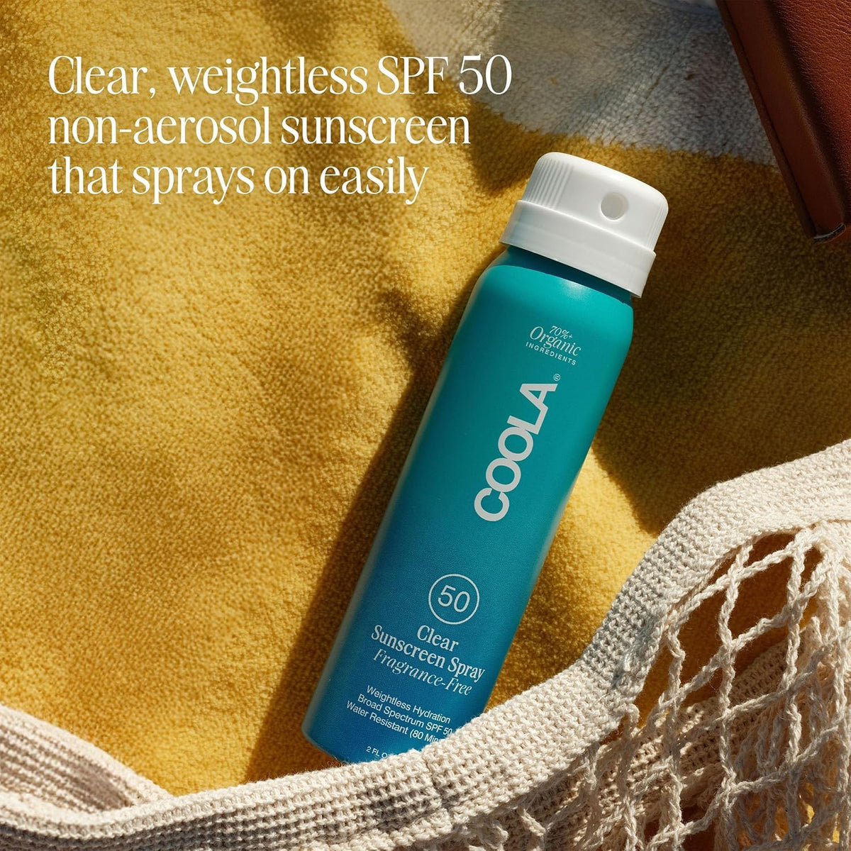 COOLA being applied at the beach for active sun protection outdoors