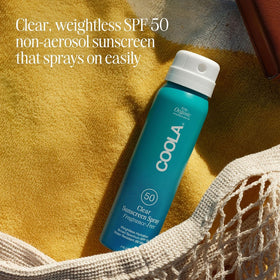 COOLA being applied at the beach for active sun protection outdoors