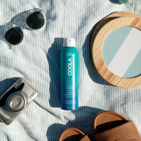 COOLA applied on skin at the beach for fast invisible protection