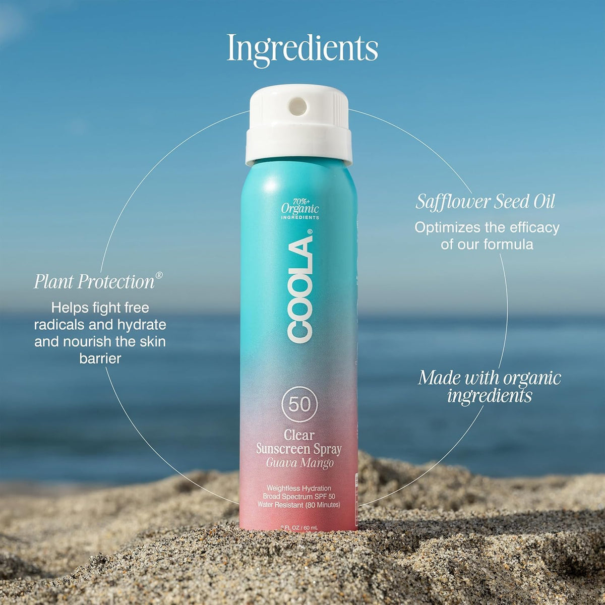 COOLA spray being applied at beach showing water‑resistant protection