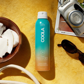 COOLA mist texture spraying into air showing lightweight fast-absorbing finish