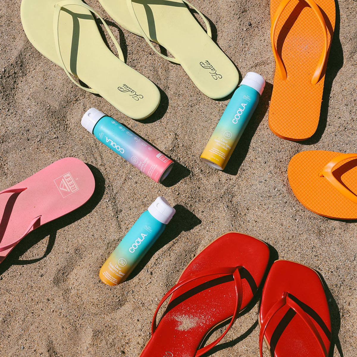 COOLA bottle in beach bag showing on-the-go protection for outdoor days