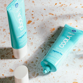 COOLA in a beach bag signaling reef-compliant travel protection