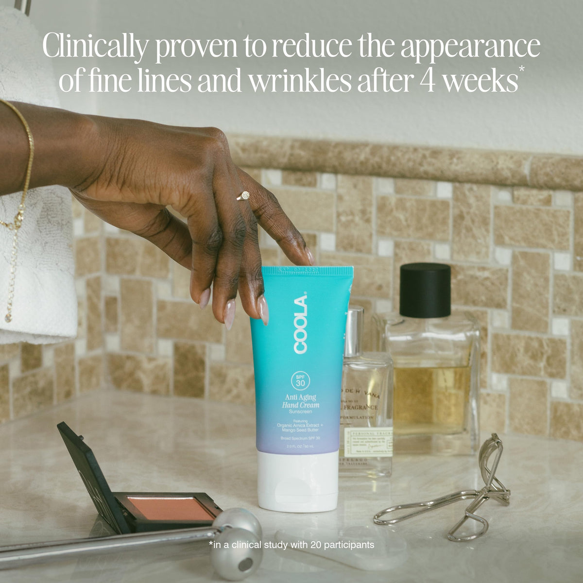 COOLA 2 fl oz tube inside purse showing travel-ready convenience