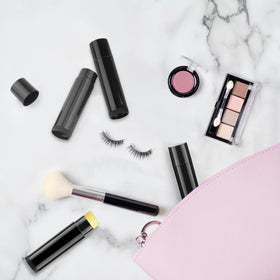 Cositina tube next to coin size comparison highlighting compact travel-friendly size