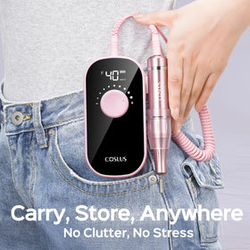 COSLUS E51 beside a ruler showing compact scale and easy storage