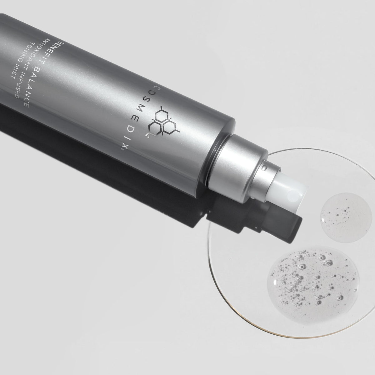 COSMEDIX toner styled in a bathroom setting suggesting daily routine convenience benefit