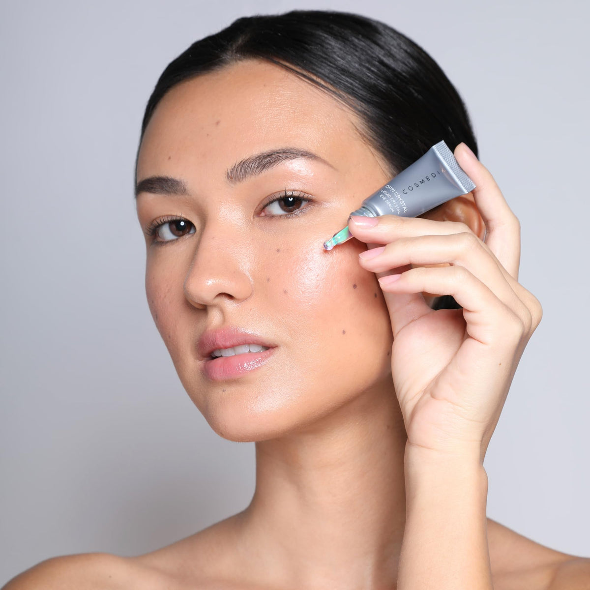COSMEDIX bottle staged in bathroom emphasizing daily routine and practicality benefit