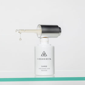 COSMEDIX bottle staged on shelf conveying daily skincare routine benefit