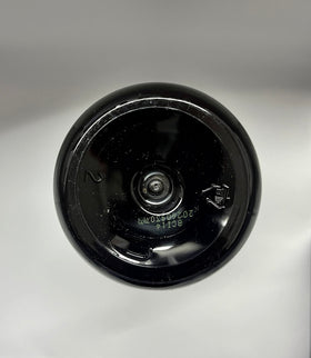 COSMOCOS bottle on bathroom shelf, suggests everyday routine use