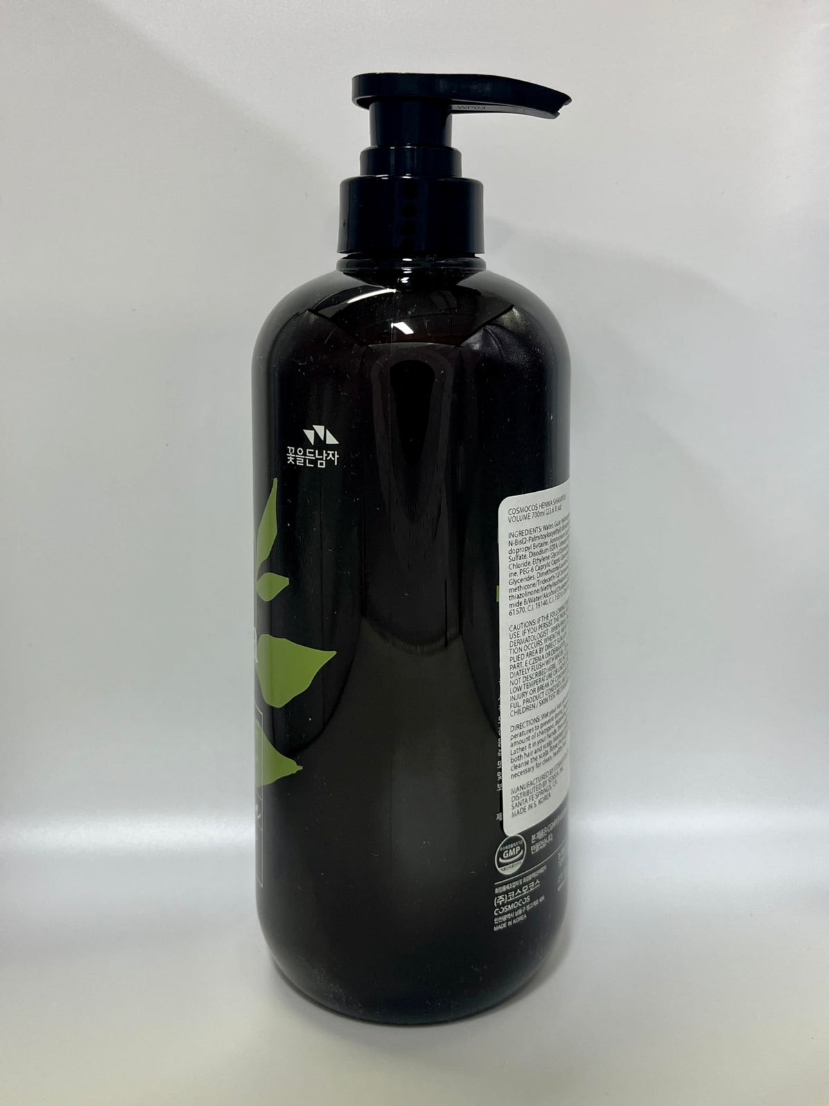 COSMOCOS henna leaves beside bottle, emphasizes botanical source