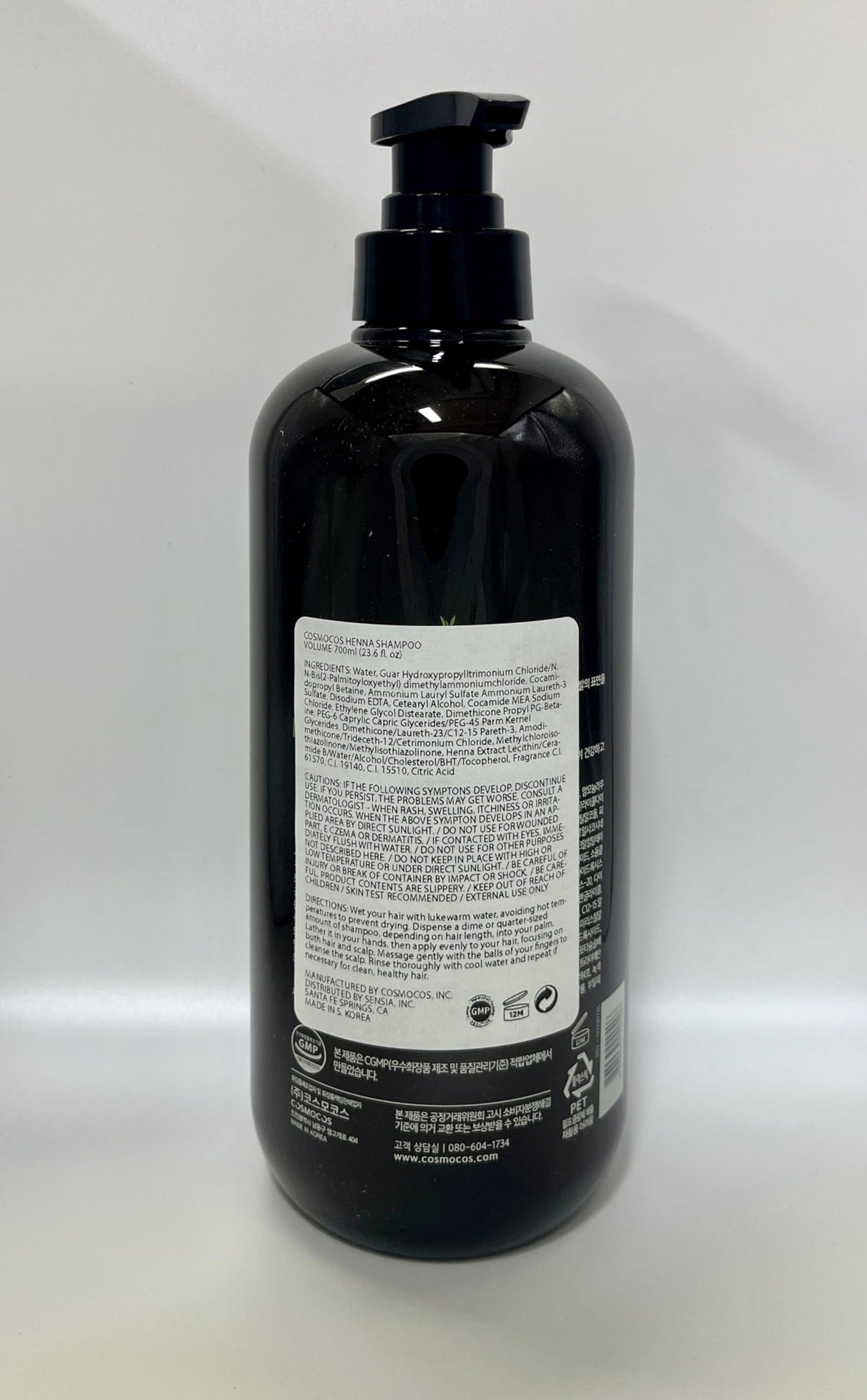 COSMOCOS bottle being used in shower, demonstrates practical application