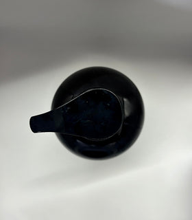 COSMOCOS bottle held in hand for scale, shows large 700 ml size