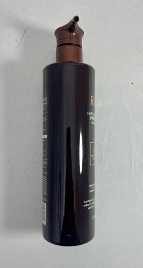 COSMOCOS RG3 shampoo in shower being massaged into scalp for strength