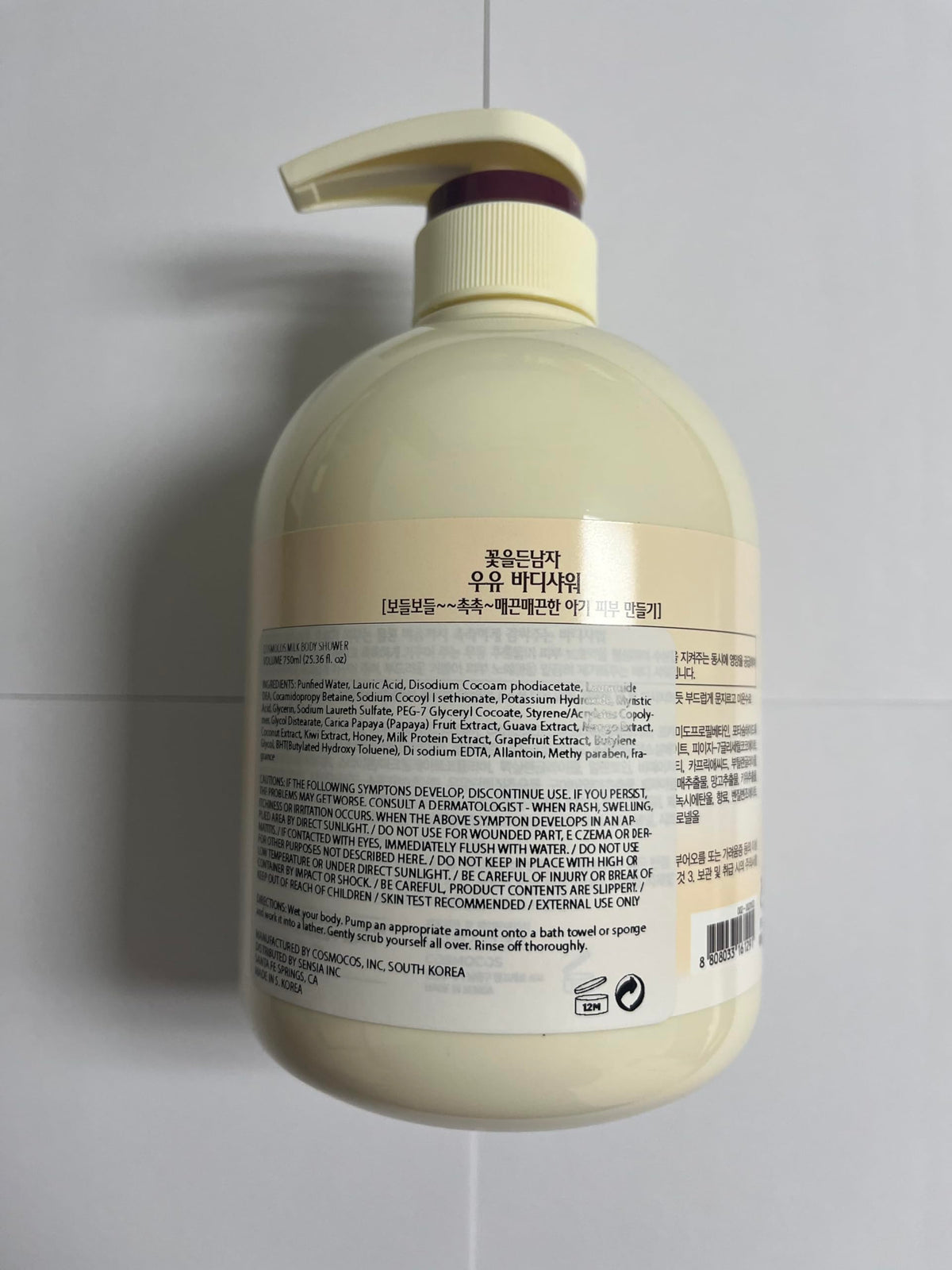 COSMOCOS bottle beside a hand to show 750 ml scale and value for frequent use