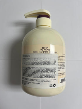 COSMOCOS bottle beside a hand to show 750 ml scale and value for frequent use