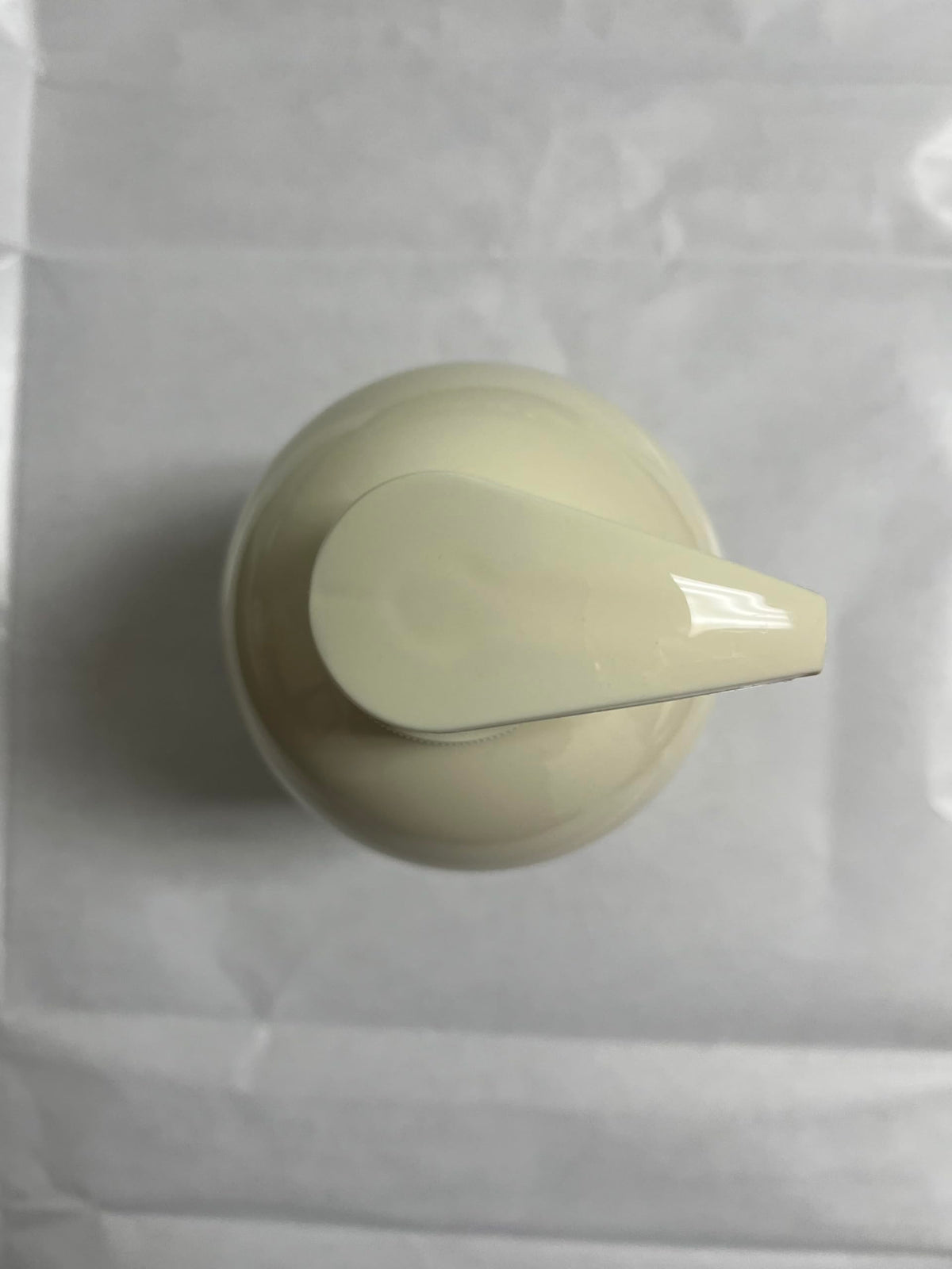 COSMOCOS empty bottle close-up emphasizing recyclable packaging and sustainable disposal
