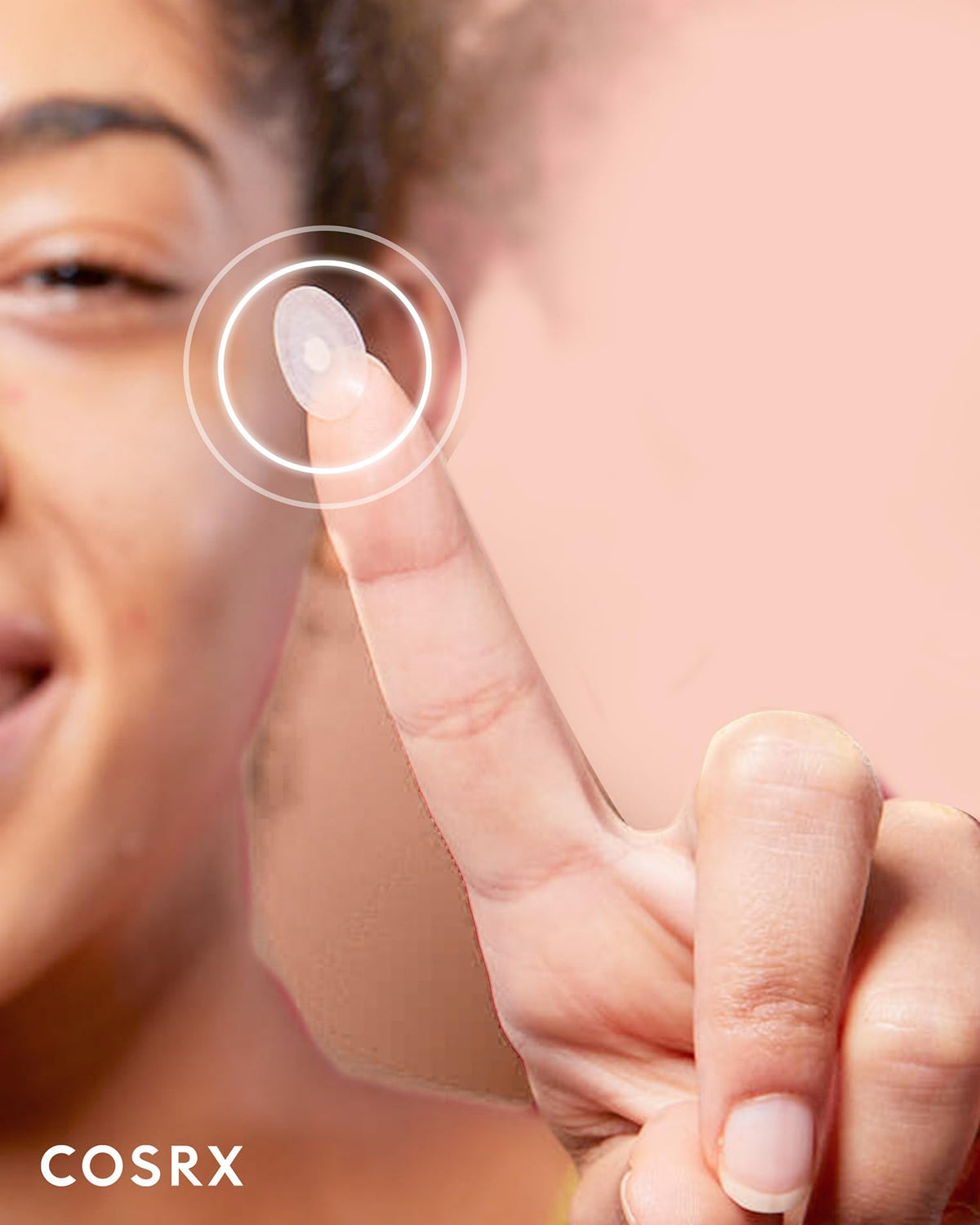COSRX patch in hand illustrating size and easy application