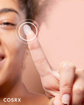 COSRX patch in hand illustrating size and easy application