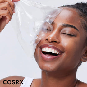 COSRX three-pack flatlay with travel items showing on-the-go skincare benefit