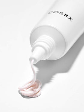 COSRX spot cream dotted on blemish showing targeted application benefit
