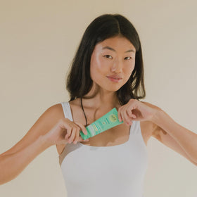 CoTZ being rubbed on forearm to show even body coverage and blendability