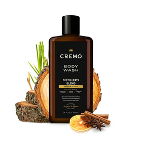 Cremo bottle in hand showing 16 fl oz scale for travel and value benefit