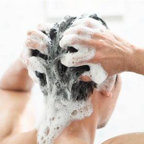 Cremo bottle in shower scene conveying easy everyday use