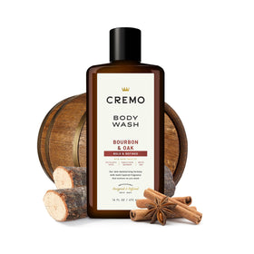 Cremo 16 fl oz bottle held to show size and travel-friendly portion benefit
