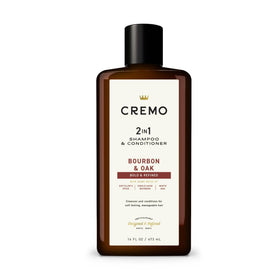 Cremo bottle next to hand showing true 16 fl oz size