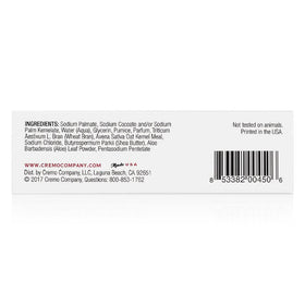 Cremo travel-size bar beside toiletries for convenient portability benefit