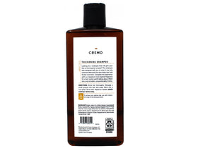 Cremo bottle on shower shelf demonstrating durable design and daily grooming benefit