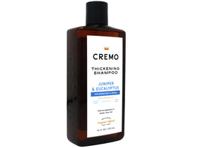 Cremo bottle next to hand showing 16 fl oz scale and travel-friendly benefit