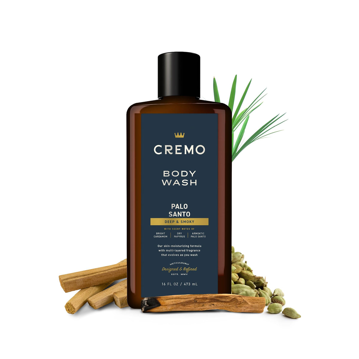 Cremo bottle next to everyday items for scale benefit: clear 16 fl oz size reference
