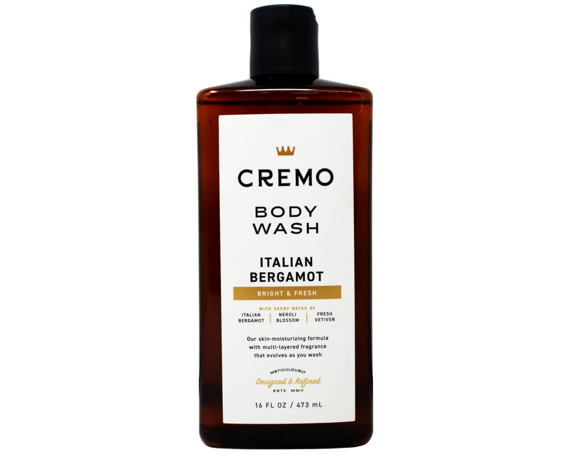 Cremo bottle held in hand for scale showing generous 16 fl oz size