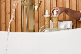 Baby in bathtub using Cristina's Curls set showing calmer, quicker bath time