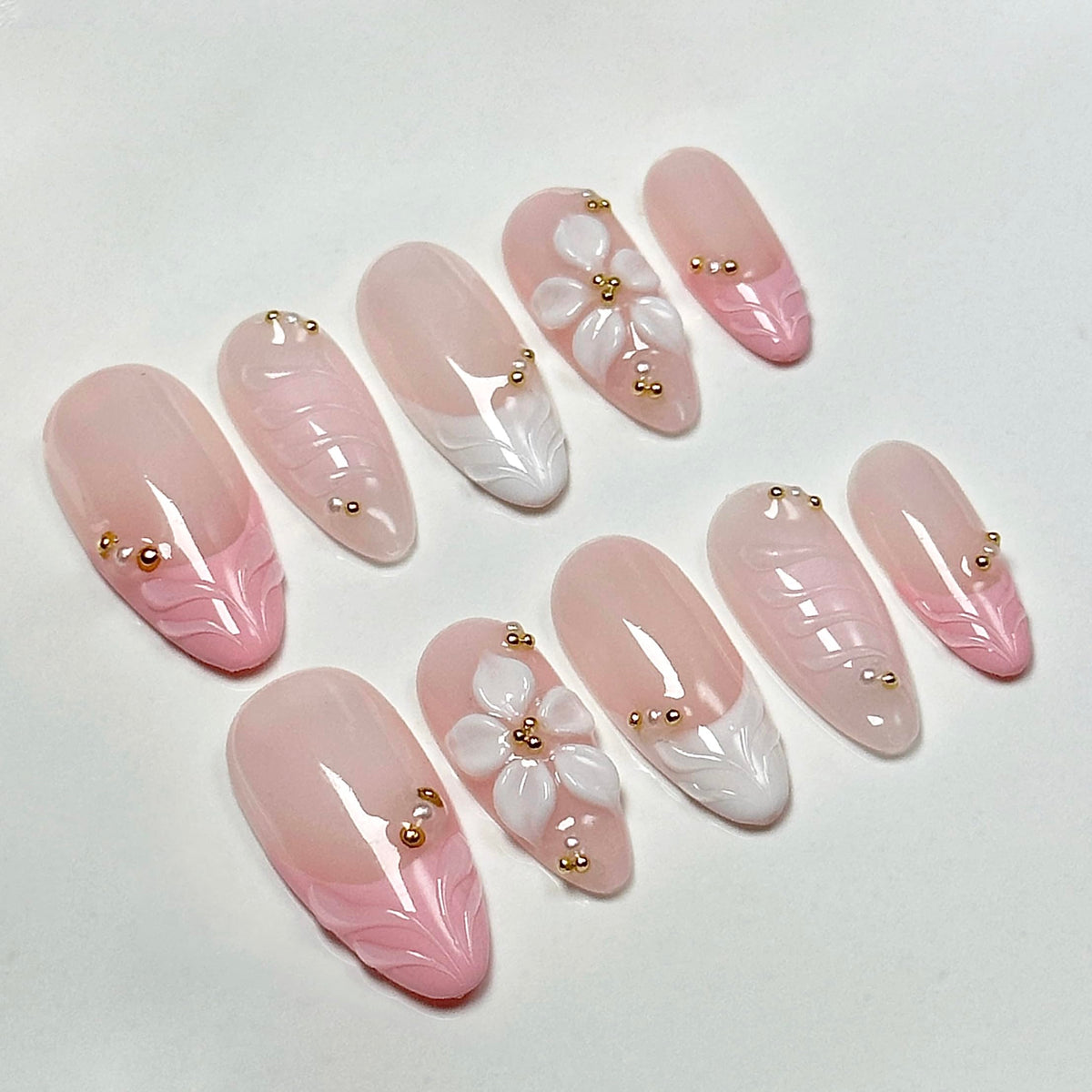 CTTHNBD nails in hand demonstrating size M fit and realistic almond scale for selection