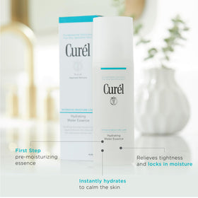 Curel applying essence to face with cotton pad for calming pre-moisturizer step