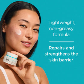 Curel cream on hand being smoothed for quick absorption and soft skin