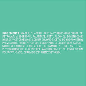 Curel travel bottle next to toiletries for portability benefit
