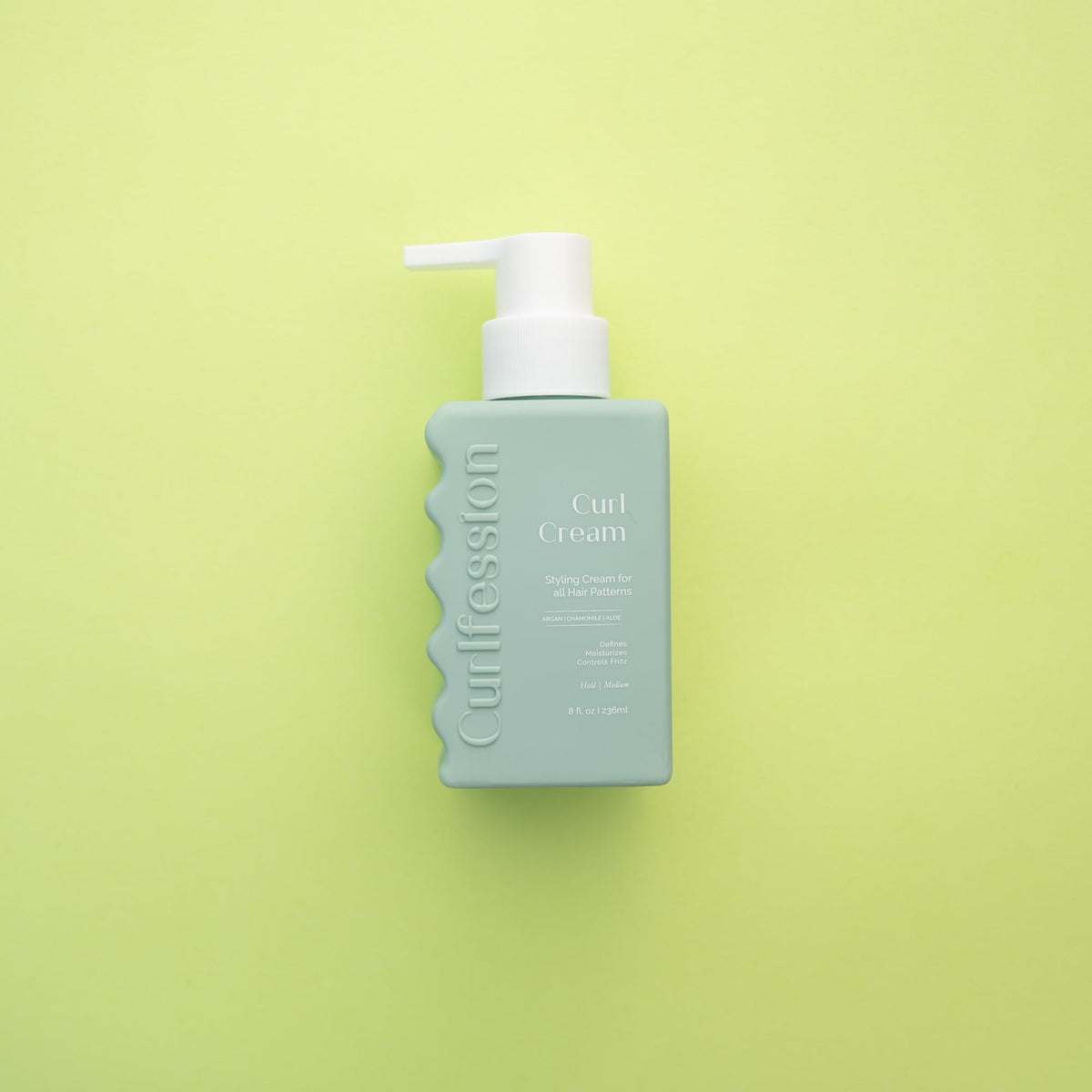 CURLFESSION applied to damp hair demonstrating reduced frizz and definition