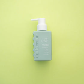CURLFESSION applied to damp hair demonstrating reduced frizz and definition