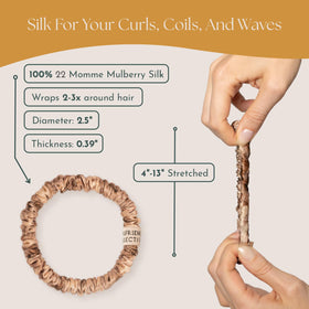 Curlfriend Collective scrunchie held in hand to show size and scale for thick hair
