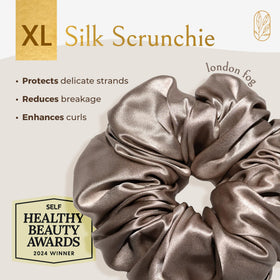 Curlfriend Collective close-up of 22 Momme Mulberry silk texture highlighting smooth, low-friction surface