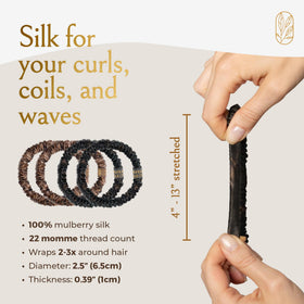 Curlfriend Collective scrunchie stretched to show elastic strength and flexible fit