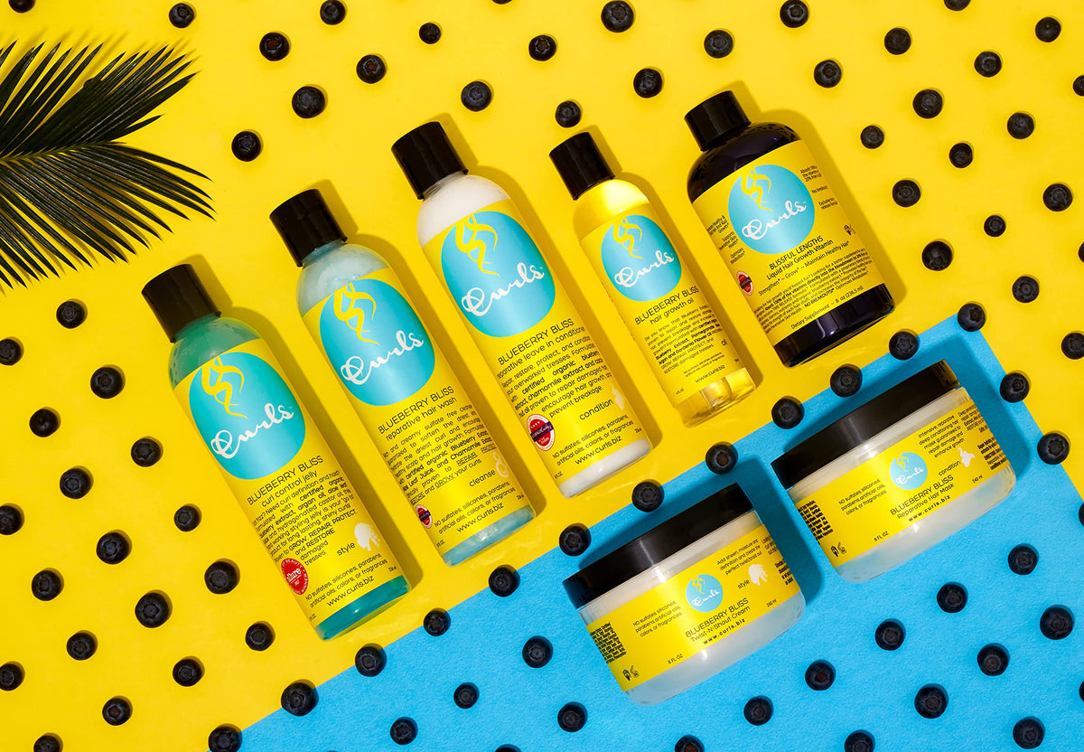 CURLS texture droplet on fingertips showing aloe glide and moisturizing feel