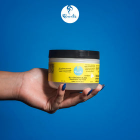 Curls cream on hand demonstrating moisturizing, easy-to-distribute texture