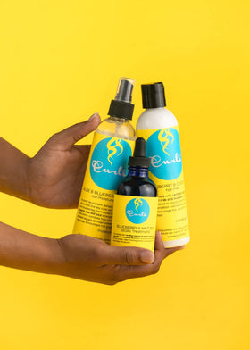 Curls Blueberry Bliss next to ruler showing 8 fl oz size and portability