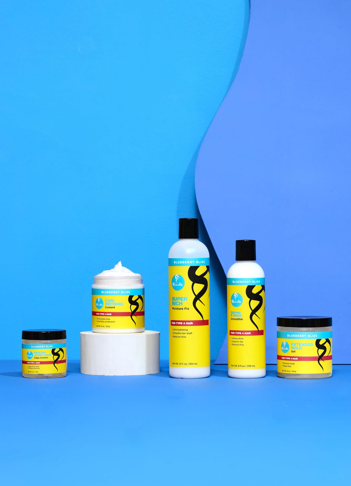 Curls Blueberry Bliss styled coils lifestyle image shows defined, frizz-free curls for long-lasting hold